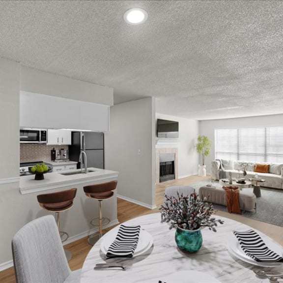 Thumbnail 3 of 9 a kitchen and living room with a table and chairs