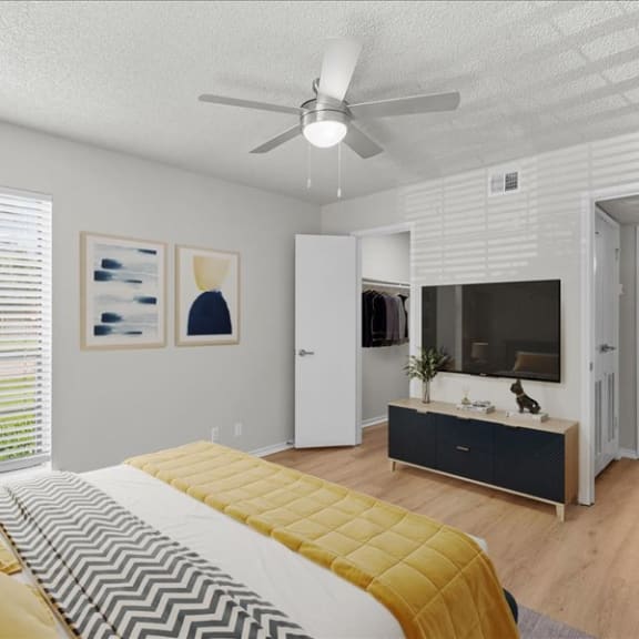 Thumbnail 5 of 9 a bedroom with a bed and a ceiling fan