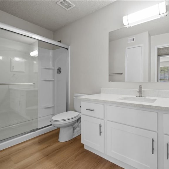 Thumbnail 6 of 9 a bathroom with a sink toilet and a shower