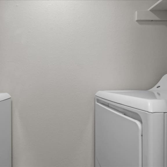 Thumbnail 9 of 9 a white washer and dryer in a white room