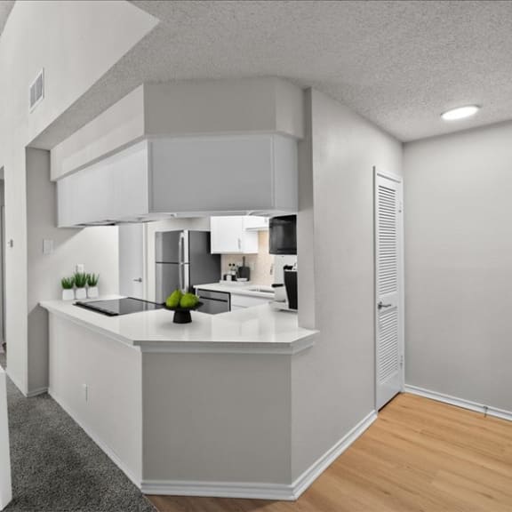 Thumbnail 12 of 13 an open kitchen and dining room with a white table