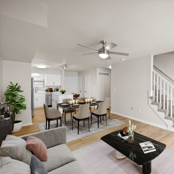 Thumbnail 2 of 13 the living room and dining area of a home with a staircase and a dining table