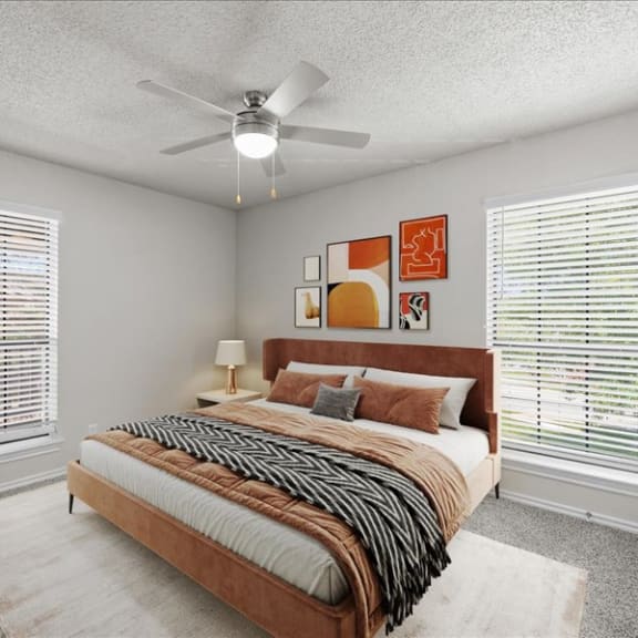 Thumbnail 4 of 13 a bedroom with a bed and a ceiling fan