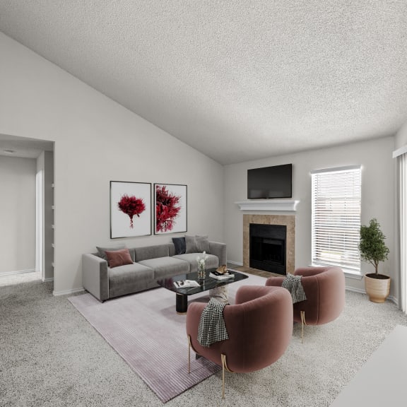 Thumbnail 2 of 13 a living room with a couch and a chair and a fireplace