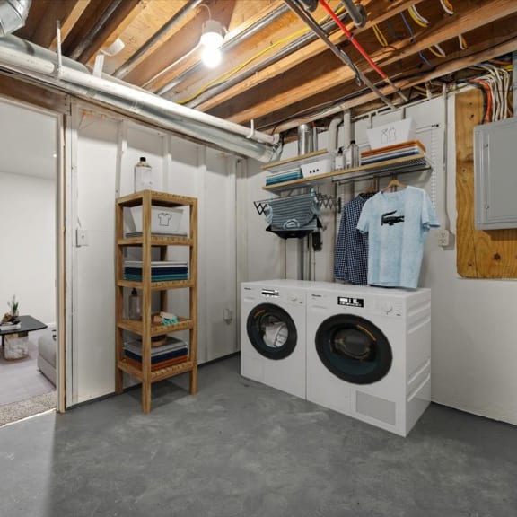 Thumbnail 12 of 13 a laundry room with a washing machine and a dryer