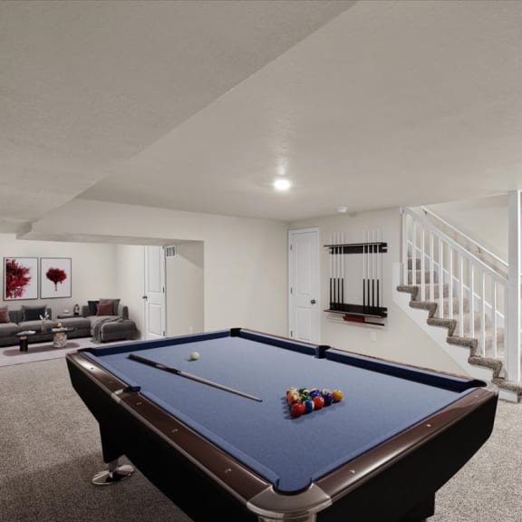 Thumbnail 8 of 10 a game room with a pool table and a staircase