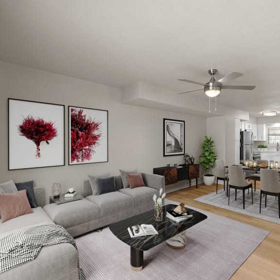 Thumbnail 6 of 13 a living room and dining room with a couch and a table