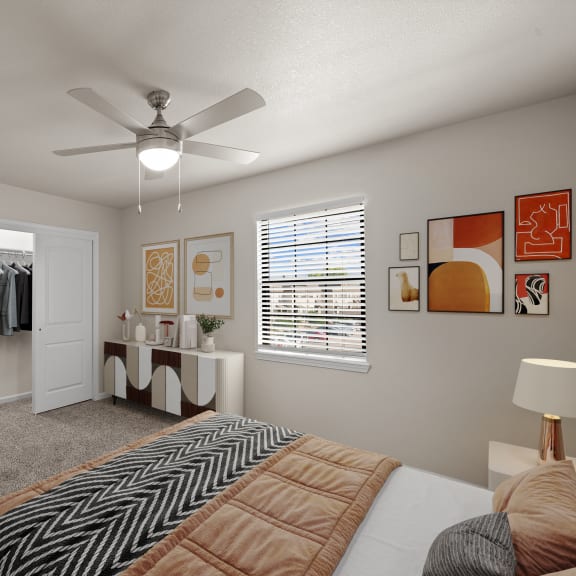Thumbnail 7 of 13 a bedroom with a large bed and a ceiling fan