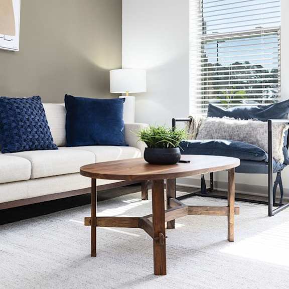 an empty bedroom with a bed and a ceiling fan