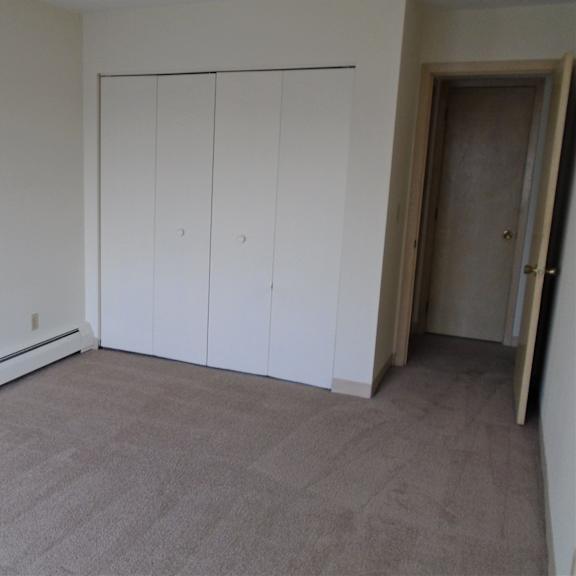 bedroom photo showing closed closet at john snell apartments