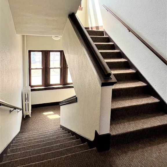 a view of the stairwell from the top of the stairs