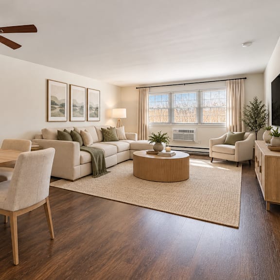 a living room with a dining table and chairs.