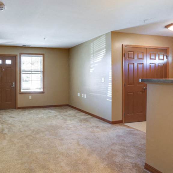 deer lakes apartments – living room – air conditioning - in-unit washer and dryer – patio – ask for a tour - pet friendly