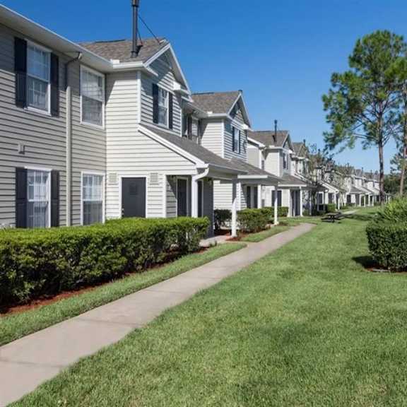 a row of houses on a sunny day
