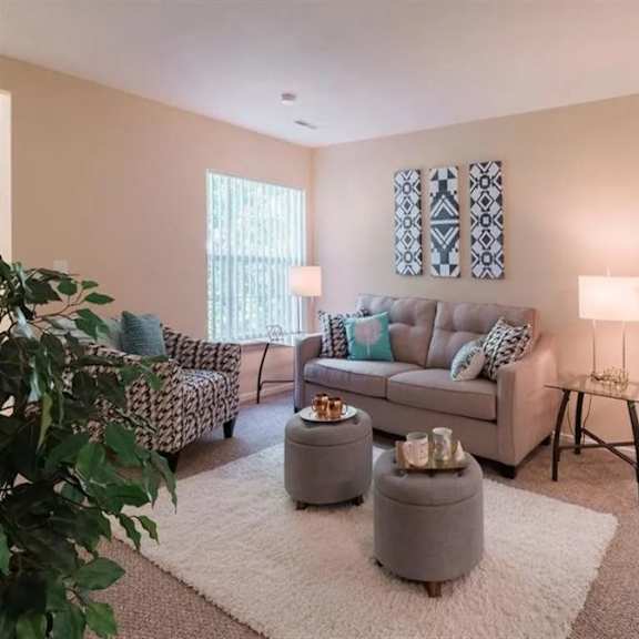 a living room with a couch and a chair