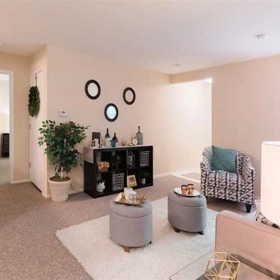a living room with a couch and a chair