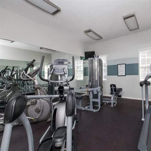 a room filled with lots of exercise equipment