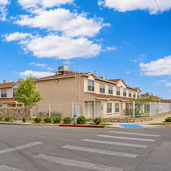 a large house with a driveway in front of it.