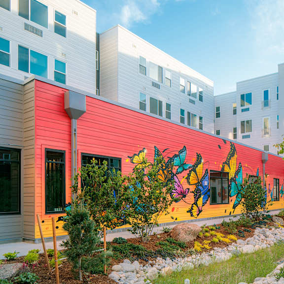 a colorful mural on a building's side.