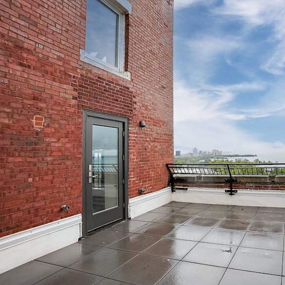Thumbnail 7 of 14 the private balcony has a view of the lake and the city at Park Heights by the Lake Apartments, Chicago, IL, 60649