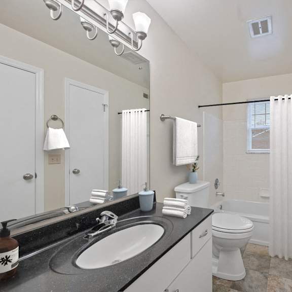 Thumbnail 11 of 13 a bathroom with a sink and a toilet and a shower at Indian Creek Apartments*, Cincinnati, OH