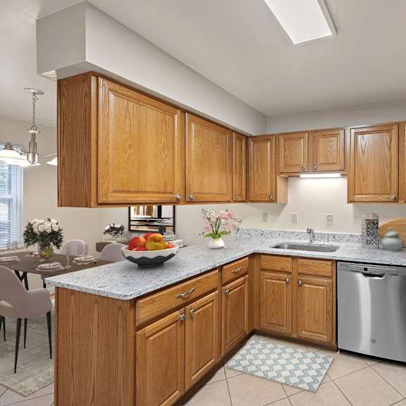 Thumbnail 3 of 13 a large kitchen with wooden cabinets and stainless steel appliances at Indian Creek Apartments*, Cincinnati, Ohio