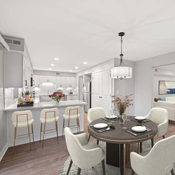 Thumbnail 4 of 25 A modern dining room with a round table and chairs. at Indian Creek Apartments*, Cincinnati, OH, 45236