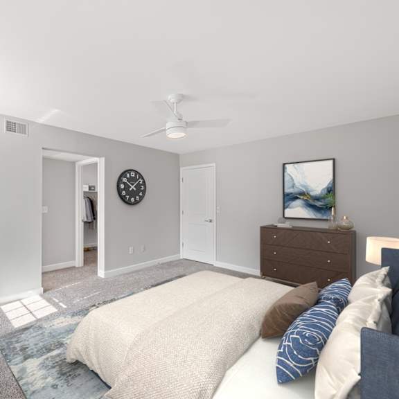Thumbnail 6 of 25 A bedroom with a bed, chair, and a plant. at Indian Creek Apartments*, Cincinnati, Ohio