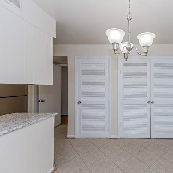 Thumbnail 8 of 22 Kitchen with white closets and doors and a tiled floor at Indian Creek Apartments*, Ohio, 45236