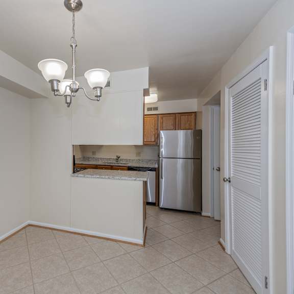 Thumbnail 7 of 22 Kitchen with a large window and a door to a refrigerator and a sink at Indian Creek Apartments*, Ohio, 45236