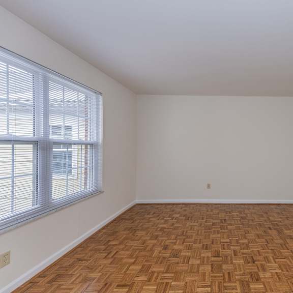 Thumbnail 11 of 22 Empty room with wood flooring and a large window at Indian Creek Apartments*, Cincinnati, OH