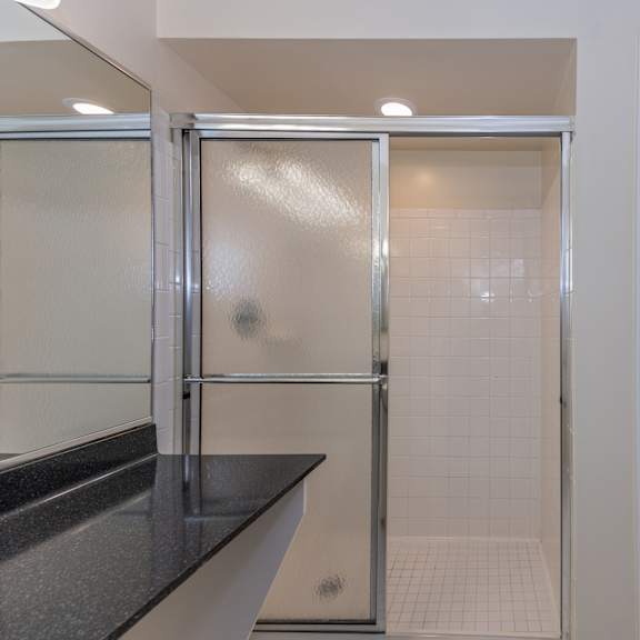 Thumbnail 20 of 22 Bathroom with a shower and a sink and a door at Indian Creek Apartments*, Cincinnati, 45236