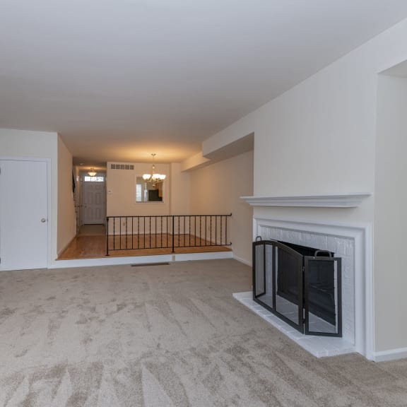Thumbnail 11 of 21 a living room with a fireplace and a carpeted floor at Indian Creek Apartments*, Cincinnati, 45236