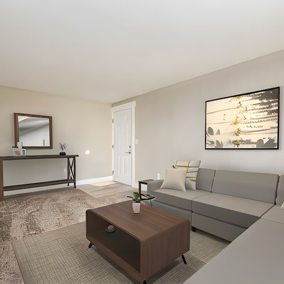 a living room with a gray couch and a coffee table