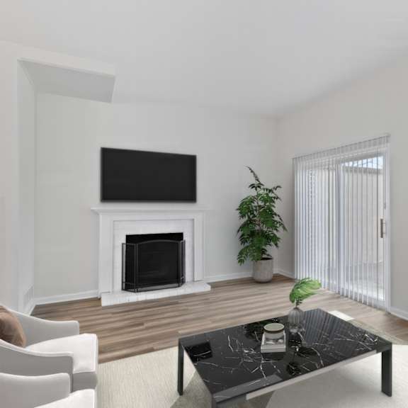 Thumbnail 4 of 12 A living room with a fireplace and a flat screen TV.
