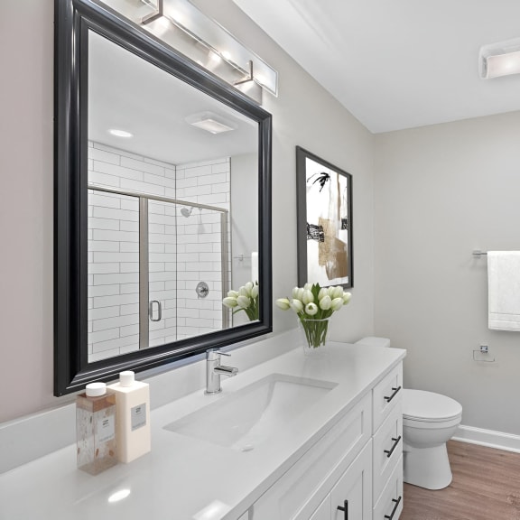 Thumbnail 10 of 10 a white bathroom with a large mirror and a toilet at Indian Creek Apartments*, Ohio, 45236