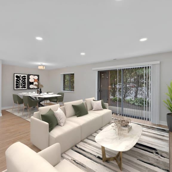 Thumbnail 6 of 10 a living room with a couch and a table at Indian Creek Apartments*, Ohio
