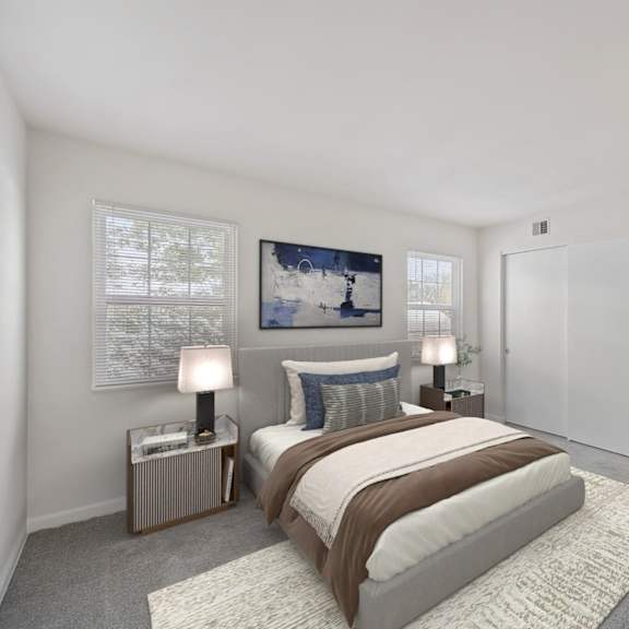 Thumbnail 6 of 10 A bedroom with a large bed, two lamps, and a painting on the wall. at Indian Creek Apartments*, Ohio, 45236