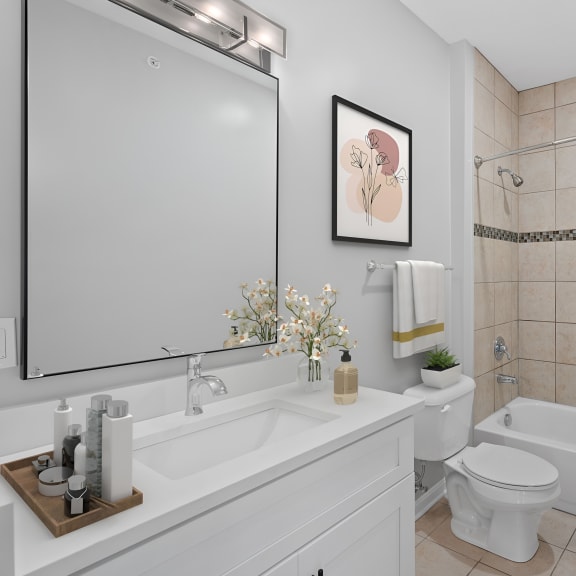 Thumbnail 7 of 7 a white bathroom with a shower toilet and sink at Monmouth Row Apartments, Newport, KY