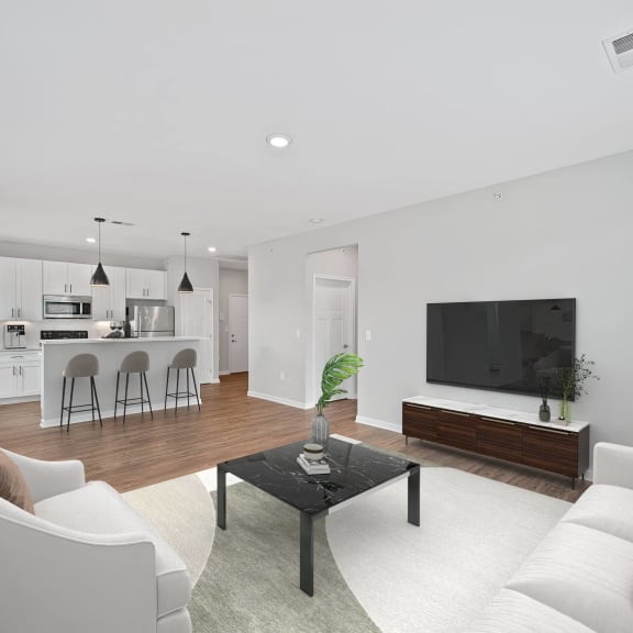Thumbnail 5 of 7 a living room with a couch and a coffee table at Monmouth Row Apartments, Newport, Kentucky