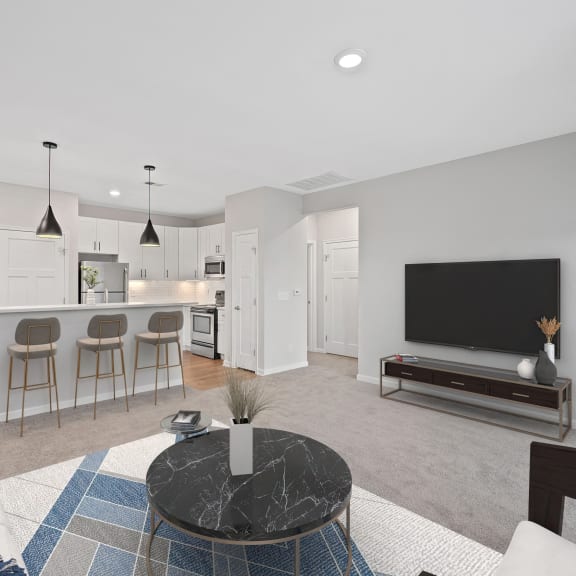 Thumbnail 5 of 8 a living room with a couch and a coffee table and a kitchen at Monmouth Row Apartments, Kentucky
