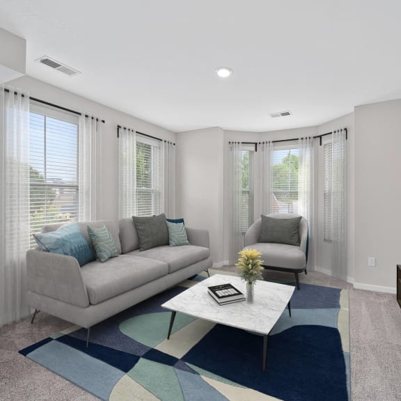 Thumbnail 4 of 6 a living room with a couch and a coffee table and a tv at Monmouth Row Apartments, Newport, 41071