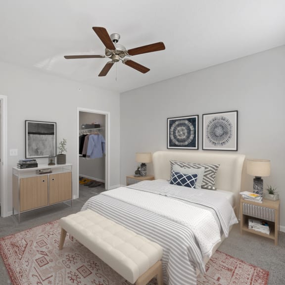 Thumbnail 6 of 7 a bedroom with a bed and a ceiling fan at Monmouth Row Apartments, Newport, KY, 41071