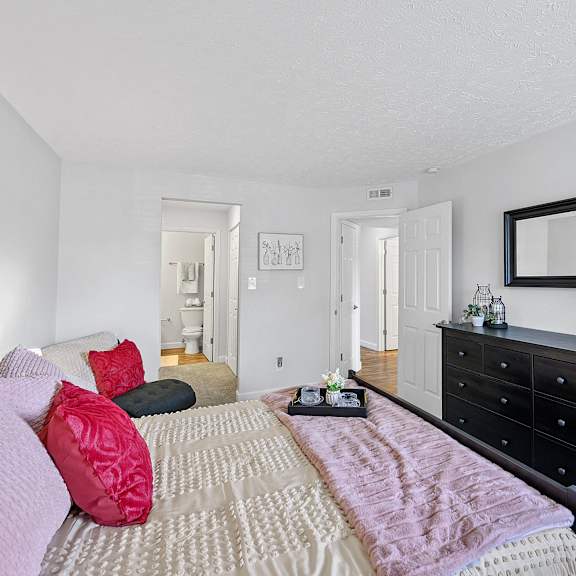 bedroom with a bed and a dresser and a mirror at wrights point, ft wright, ky