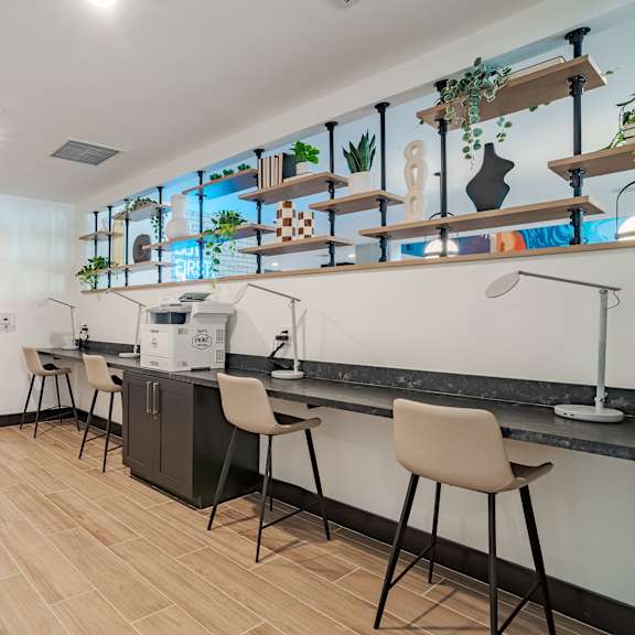 coffee bar with counter seating and open shelving at the yancey apartments, charlotte, nc 28217