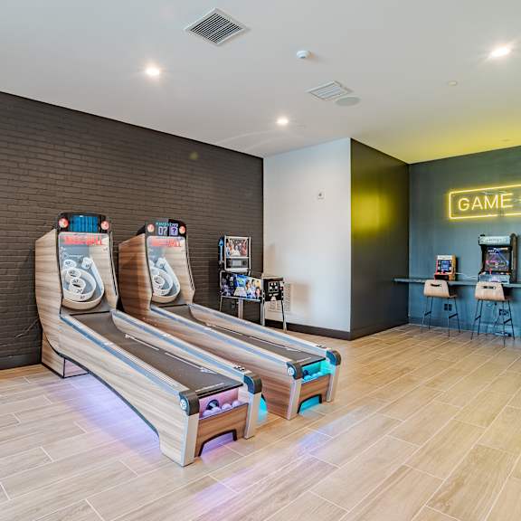 game room with skeeball and arcade machines at the yancey apartments, north carolina, 28217