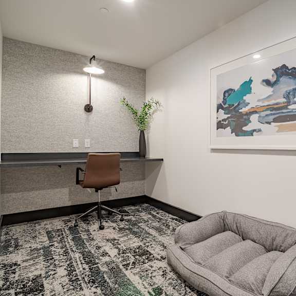 small office space with floating desk and dog bed at the yancey apartments, north carolina