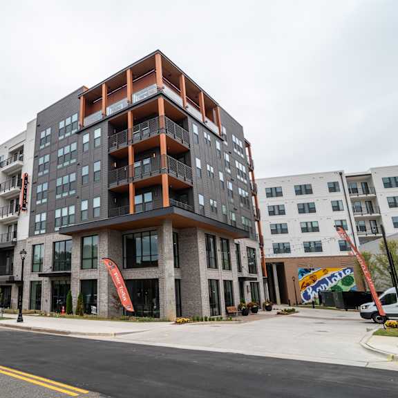 modern apartment building exterior with corner balconies at the yancey apartments, charlotte, nc 28217