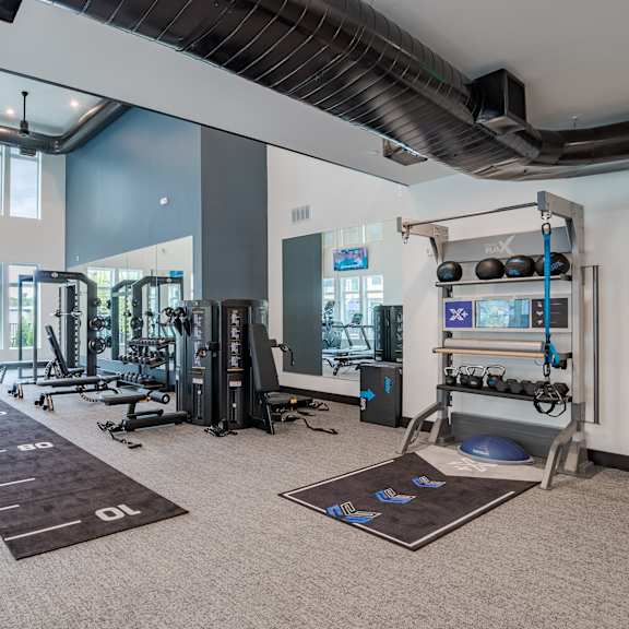 fitness center with cardio machines and functional training area at the yancey apartments, charlotte, nc 28217