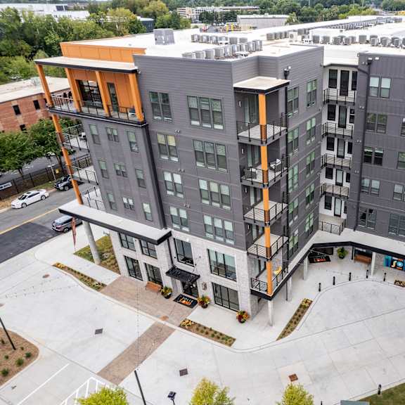 aerial view of modern apartment courtyard with gray facade at the yancey apartments, charlotte, nc 28217